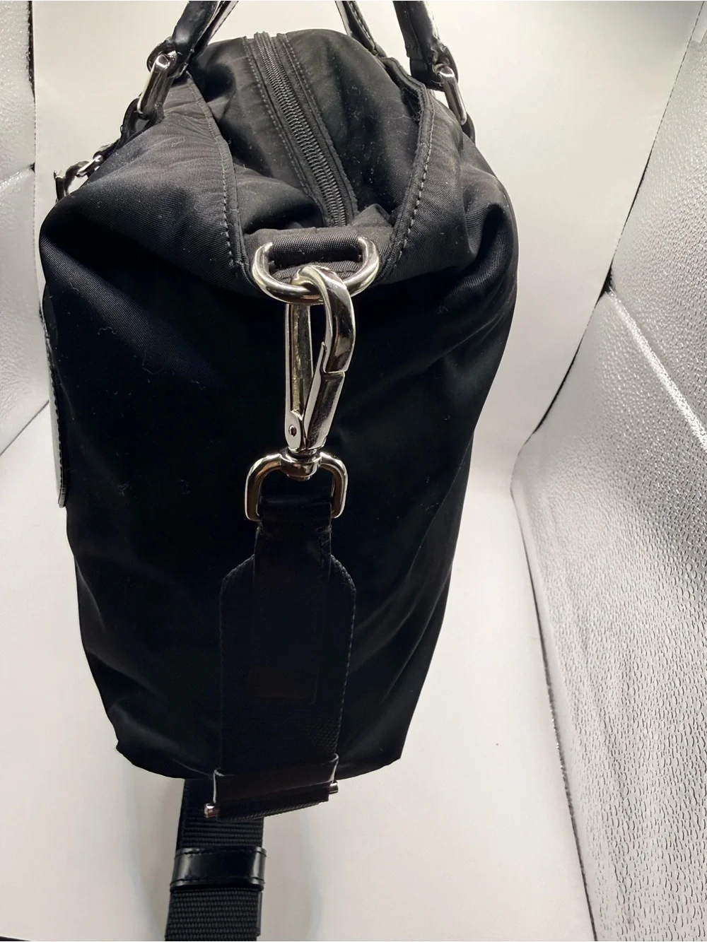Prada Black Nylon & Leather Bag with Embossed Prada logo.